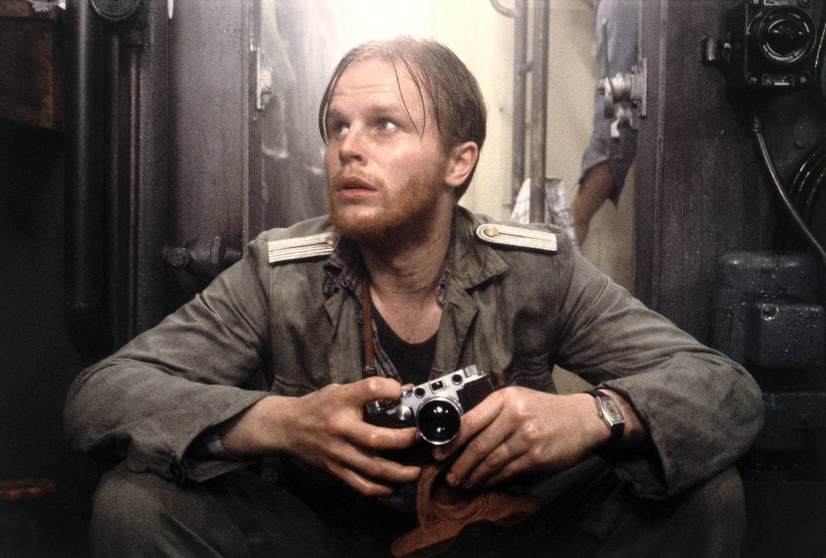 naval officer holding camera in Das Boot