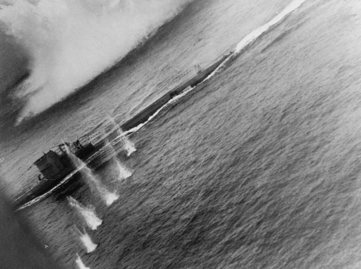 A series of small eruptions in the water show the path of an air attack  on German Submarine U-134. John T. Hitchcock piloted the VP-201