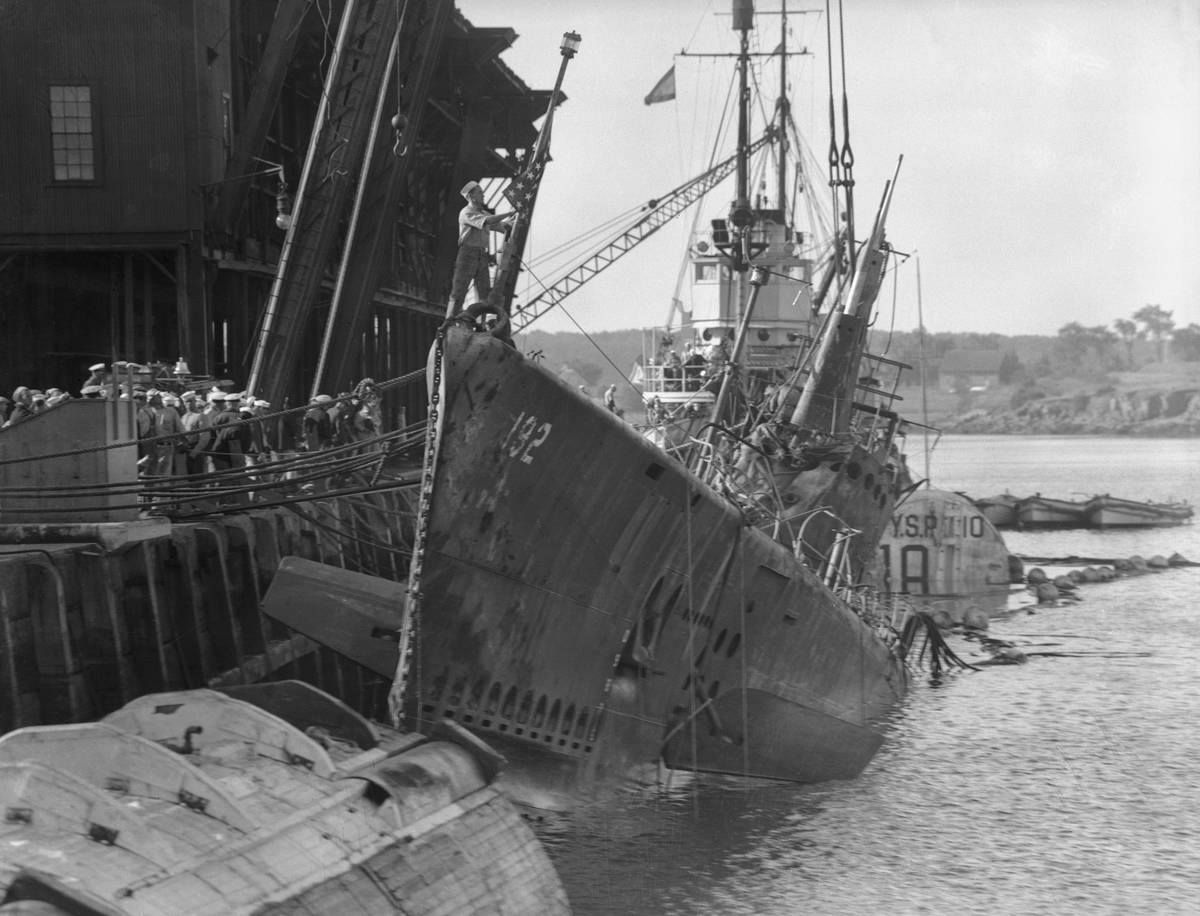 Portsmouth, N. H.: Squalus Back From The Deep. The U.S. Submarine  Squalus, to salvage which 500 men of the U.S. Navy have labored for 113 
days, is shown at her pier in Portsmouth Navy Yard today as water was 
pumped from her flooded compartments preparatory to the grim task of 
removing her 26 dead.