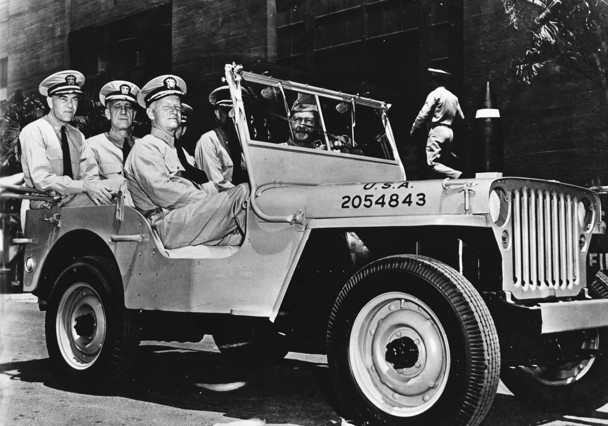 Admiral Chester William Nimitz (c), the Commander-in-Chief of the US  Pacific Fleet, takes a ride around Pearl Harbor with his aides-de-camp 
in a jeep presented to the fleet by the US Army in honour of their naval
 victory at Midway Island.