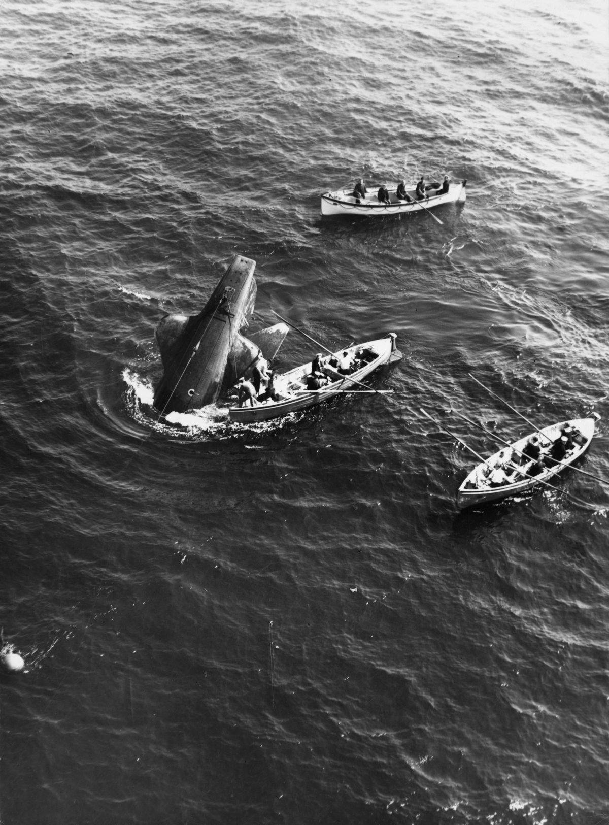 Rescue teams surround the sinking Royal Navy submarine Thetis, which  encountered difficulties during testing, in the sea off Liverpool.