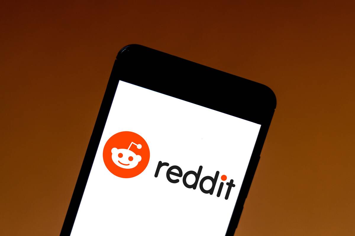 In this photo illustration the Reddit logo is seen displayed...