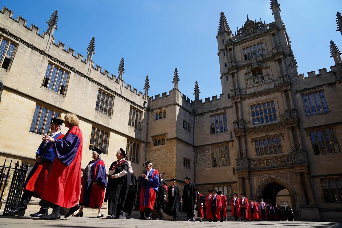 A procession makes its way to the Sheldonian Theatre, Oxford, ahead of a Oxford University degree ceremony.