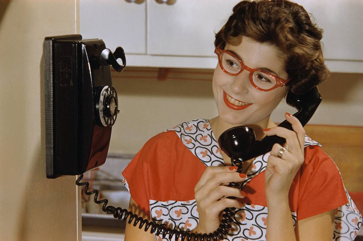 Woman Talking on Rotary Phone