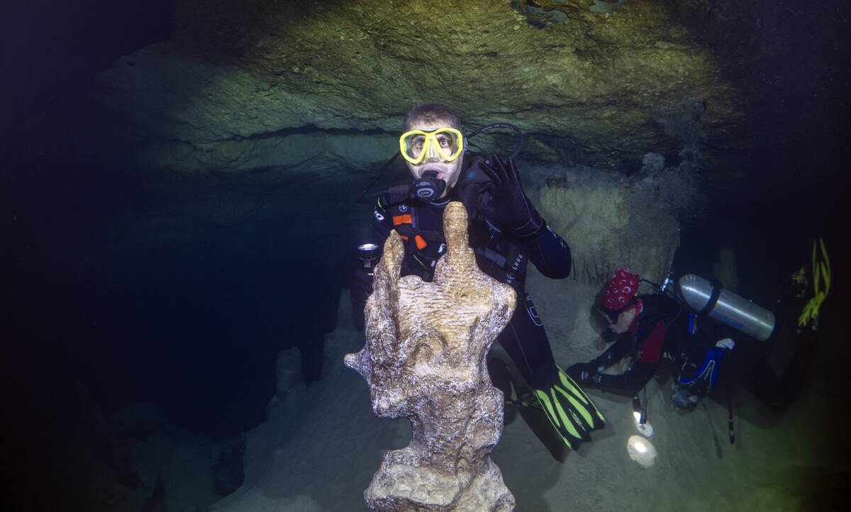 A diver is seen with stalagmite in Big Cave, Hatay, Turkiye on October 27, 2022.