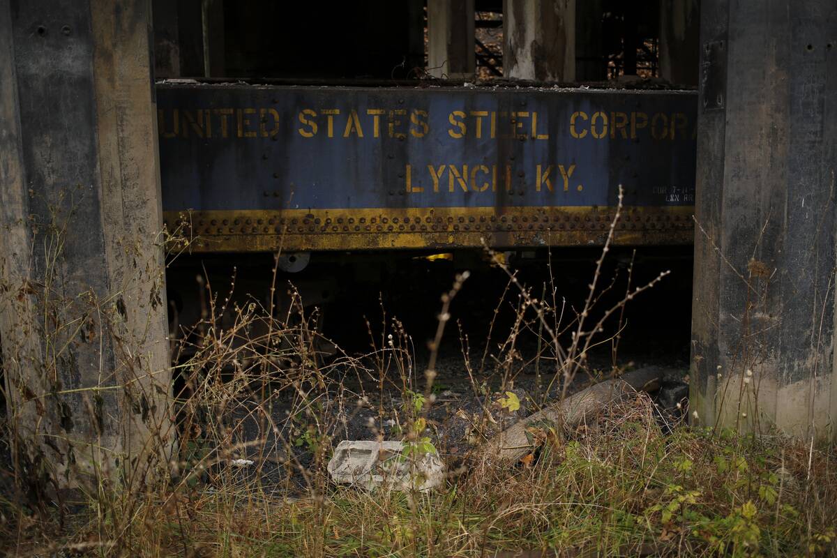 A discarded piece of railroad equipment sits beneath an abandoned coal tipple at a U.S. Steel mine in Lynch, Kentucky, U.S., on Tuesday, Nov. 5, 2013.