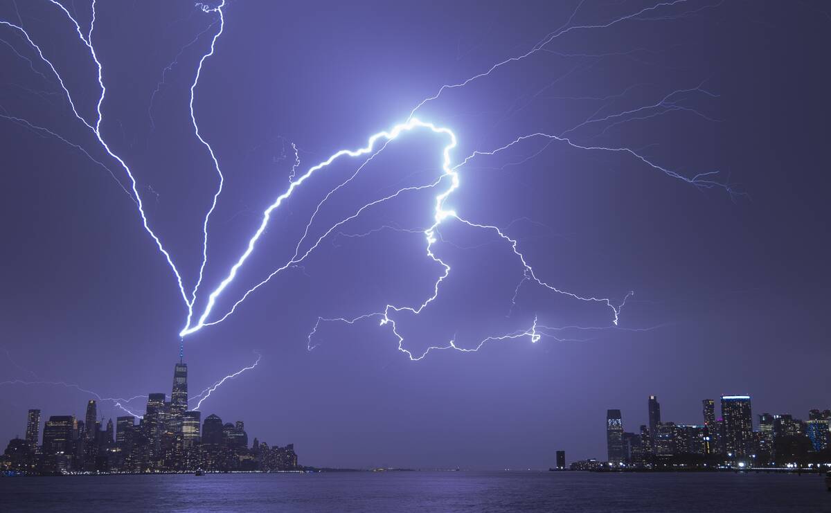 Lightning bolts strike One World Trade Center in New York City as it fans out over the Hudson River and Jersey City, New Jersey during a thunderstorm on April 1, 2023, as seen from Hoboken, New Jersey.