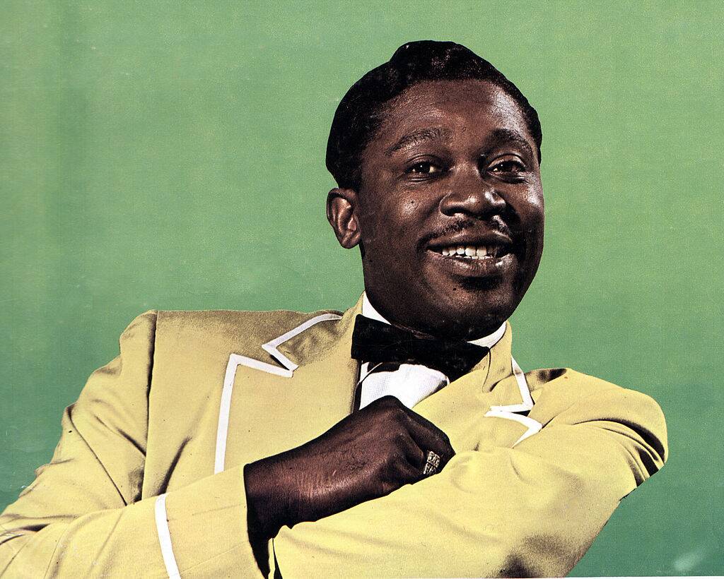 man wearing a yellow tuxedo