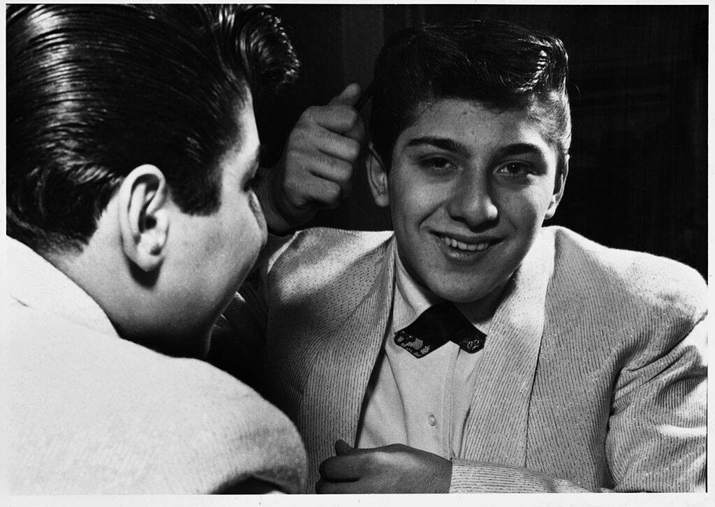 man looking at himself in the mirror