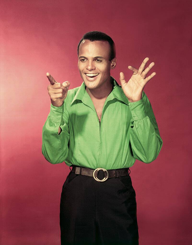 Harry Belafonte posing for a photo