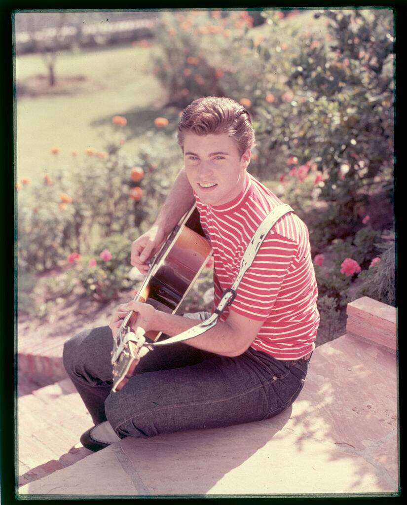 Ricky Nelson playing the guitar