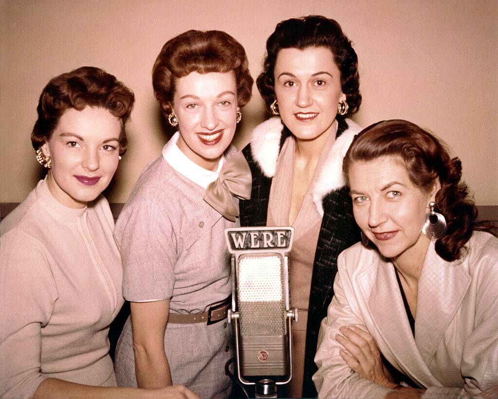 the chordettes posing for a photo