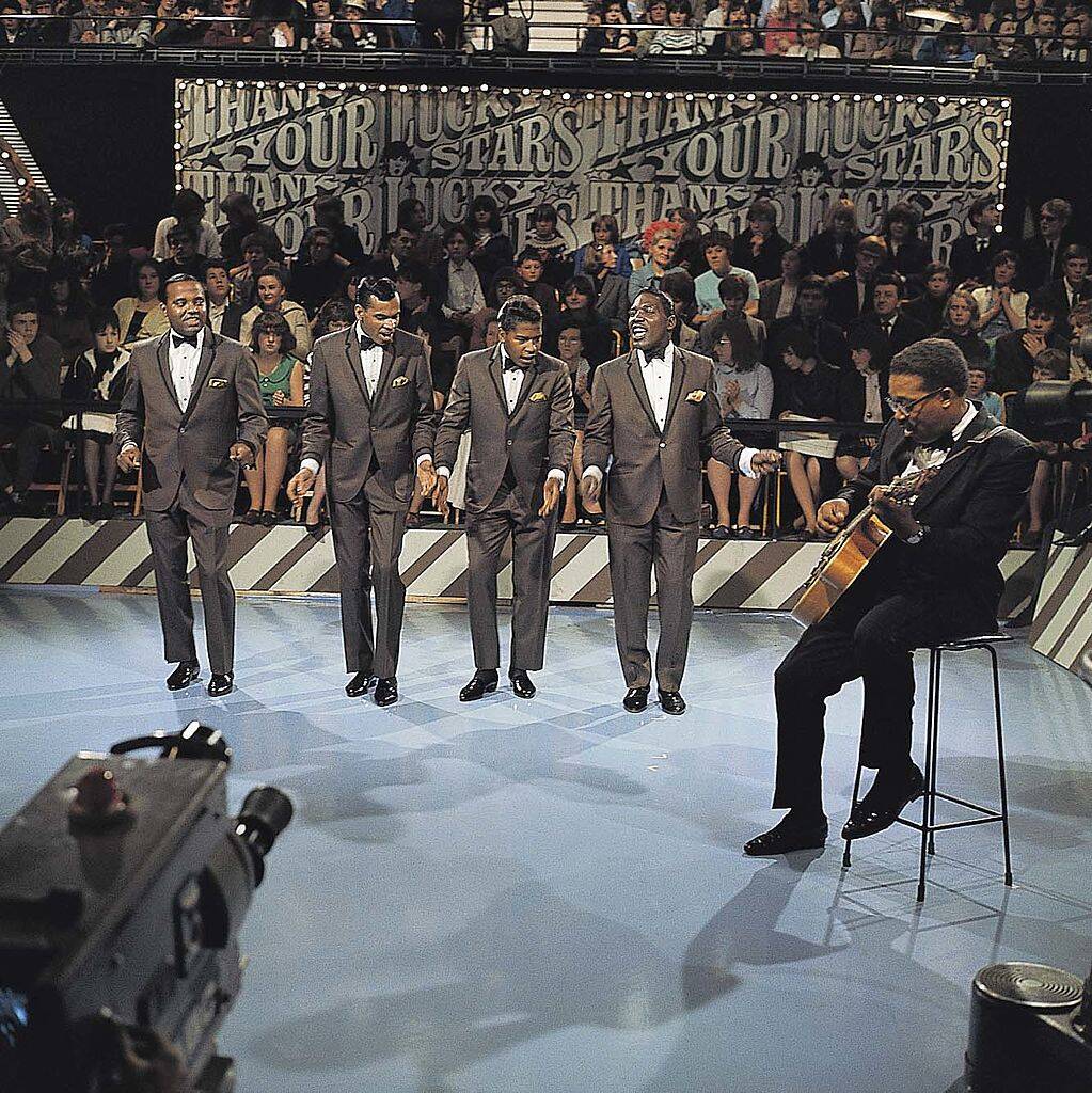 the drifters performing on stage