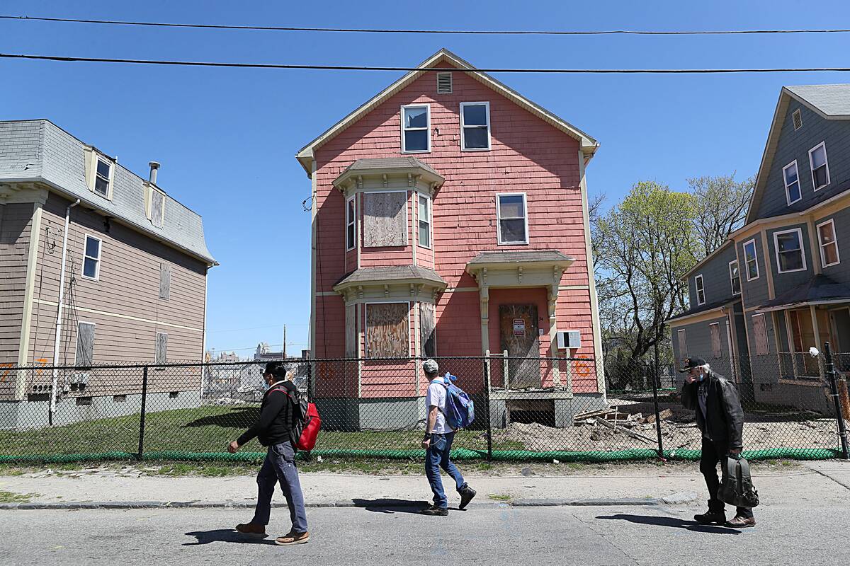 Providence, RI - April 22: Pedestrians walk on Somerset Street in Clown Town in Providence, RI on April 22, 2022.