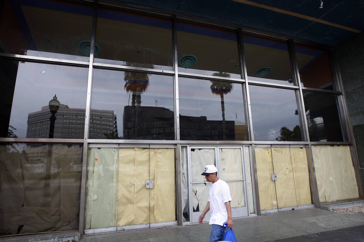 San Bernardino City Hall is reflected in the windows of one of the vacant buildings across the street on July 12, 2012 in San Bernardino, California.