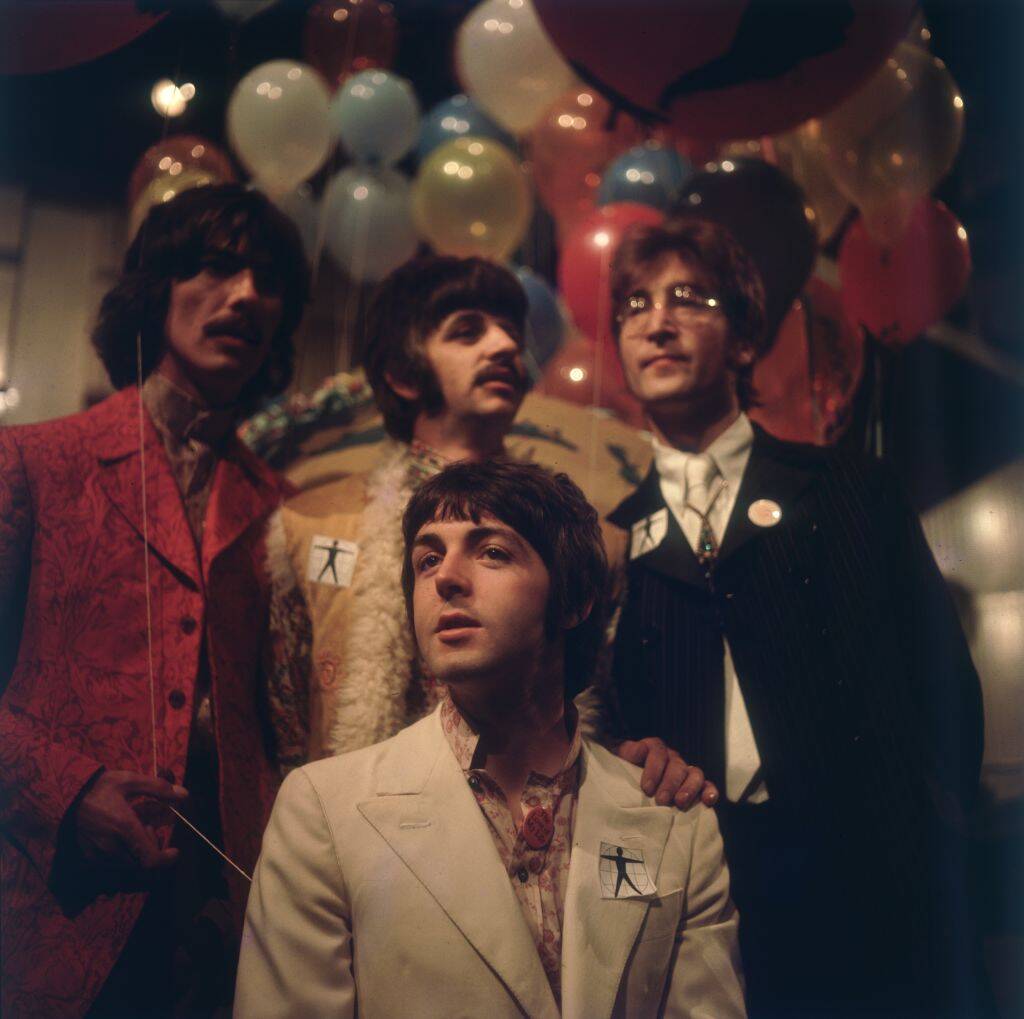 the beatles posing near balloons