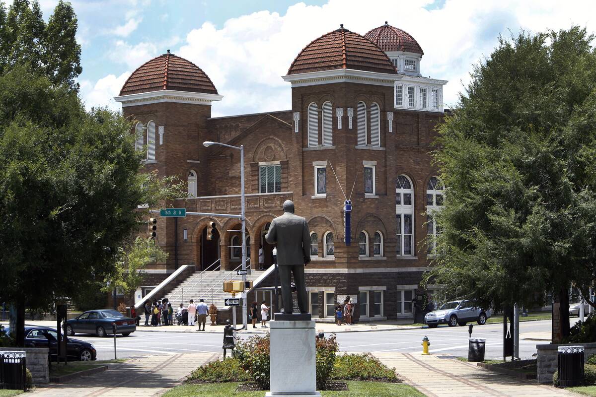 The Reverend Martin Luther King statue in Kelly Ingram Park across the street from the Sixteenth Street Baptist Church is shown Friday, June 19, 2015, in Birmingham, Ala.