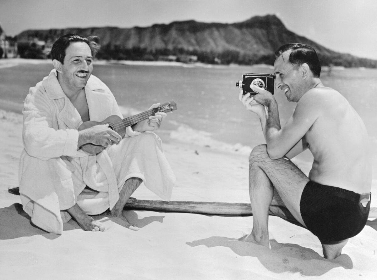 Walt Disney Being Photographed by His Brother Roy