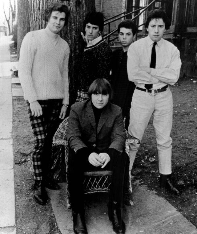 the outsiders posing for a photo