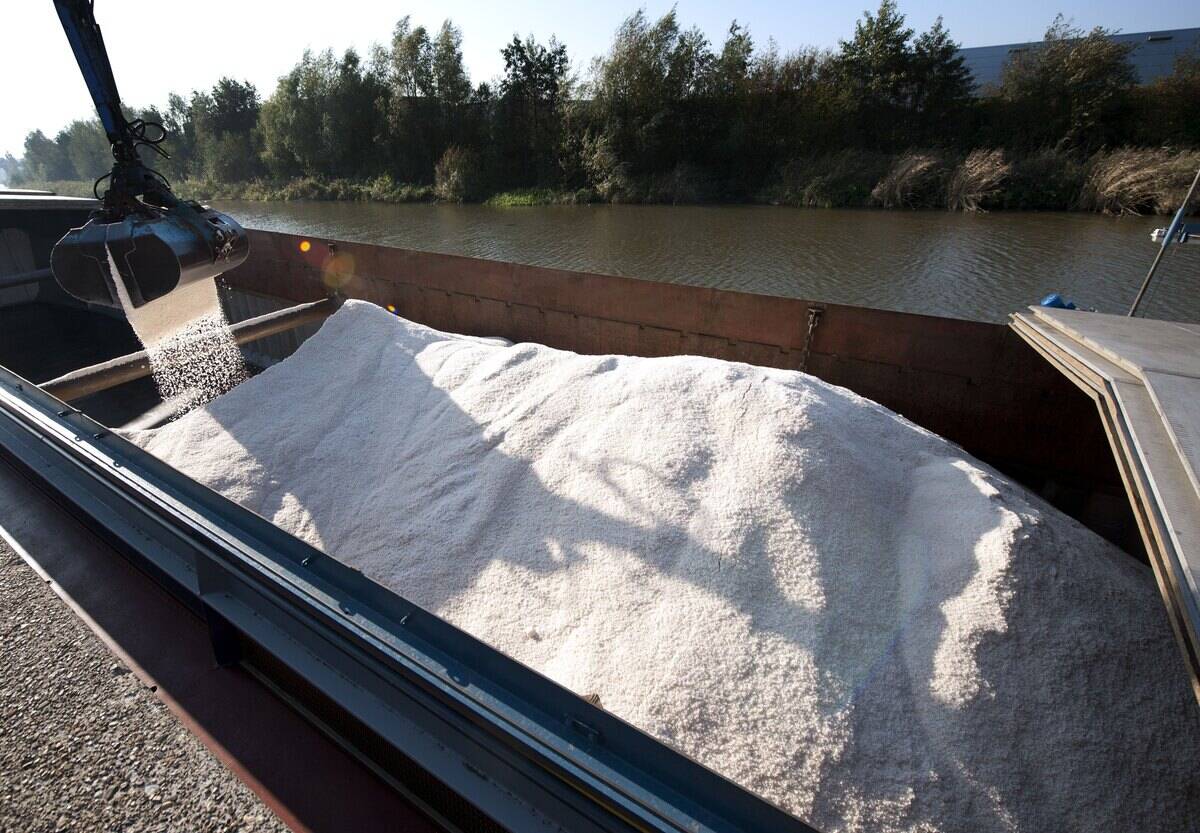 Road salt is unloaded from a barge in Doetinchem on October 24, 2011.
