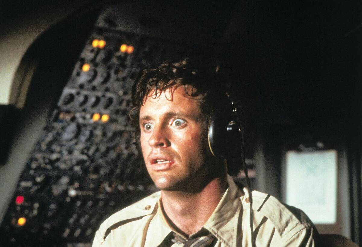 Robert Hays nervously flying airplane as Ted Striker in Airplane