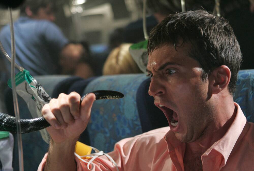 man screaming while holding snake in Snakes on a Plane