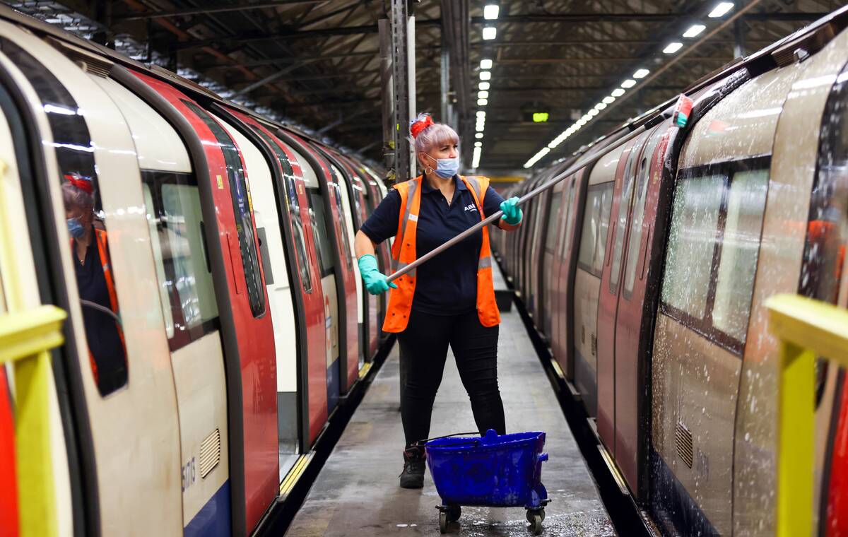 An employee cleans the outside of a train used on the Northern Line of  the London Underground network, at the Morden Traincare Centre, operated
 by Alstom SA, in London, U.K., on Tuesday, June 15, 2021.