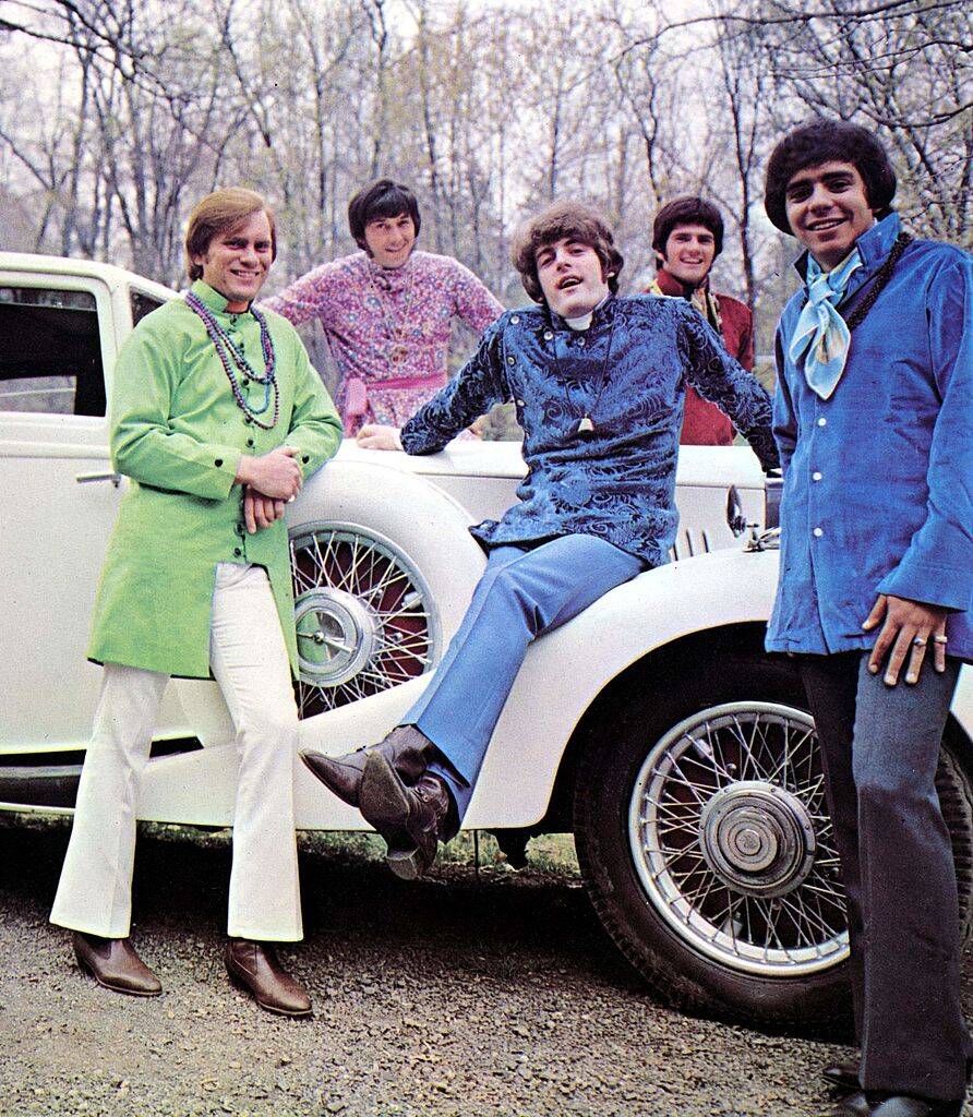 group of men wearing pastel suits