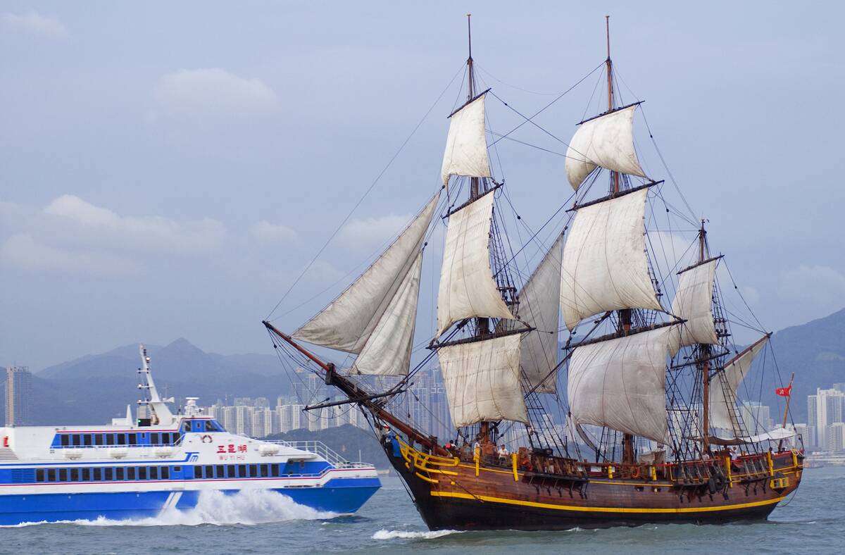 Spanish Galleon and Chinese high-speed ferry, Victoria harbor, China.