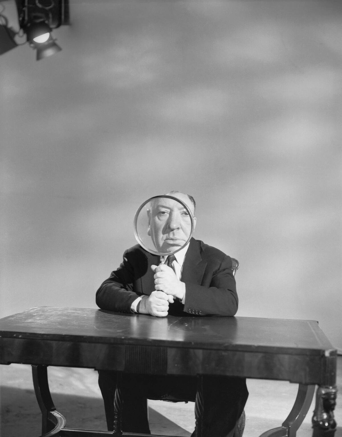 Alfred Hitchcock Holding Magnifying Glass