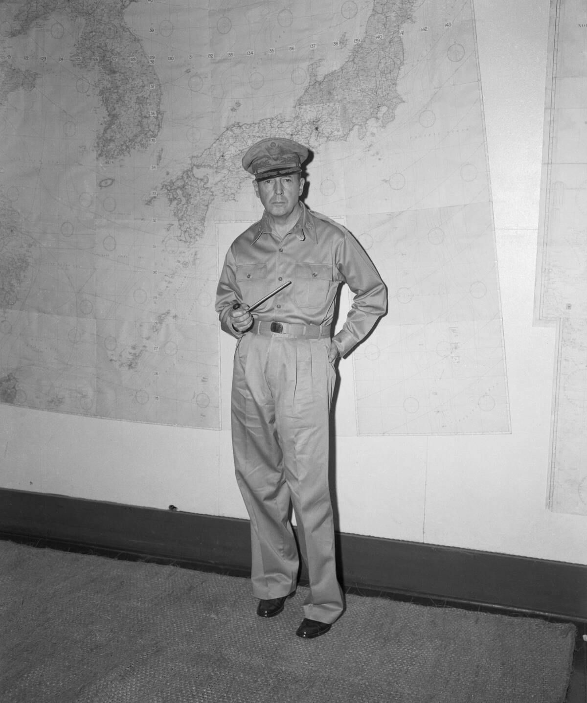 General Douglas MacArthur Holding Pipe