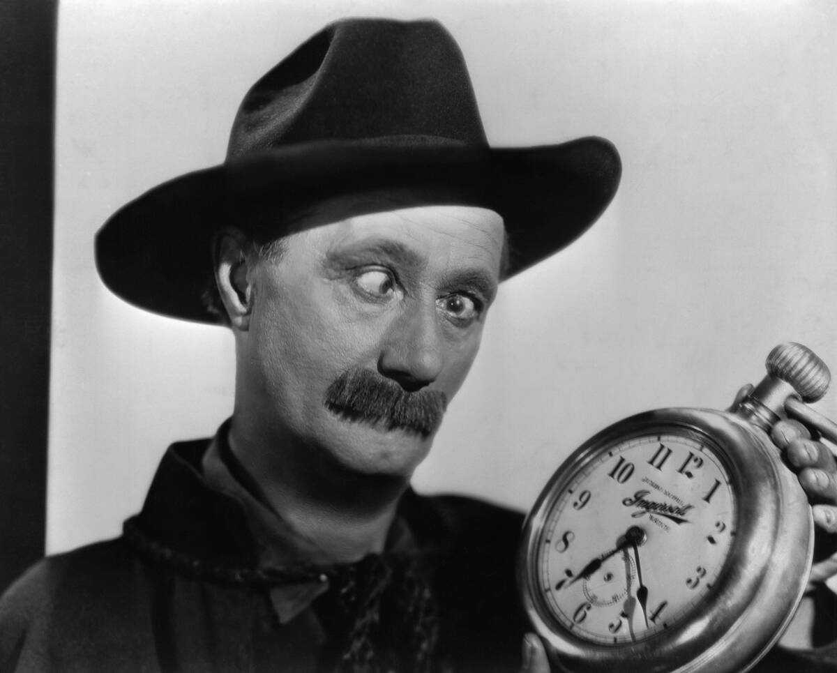 Ben Turpin Holding a Clock