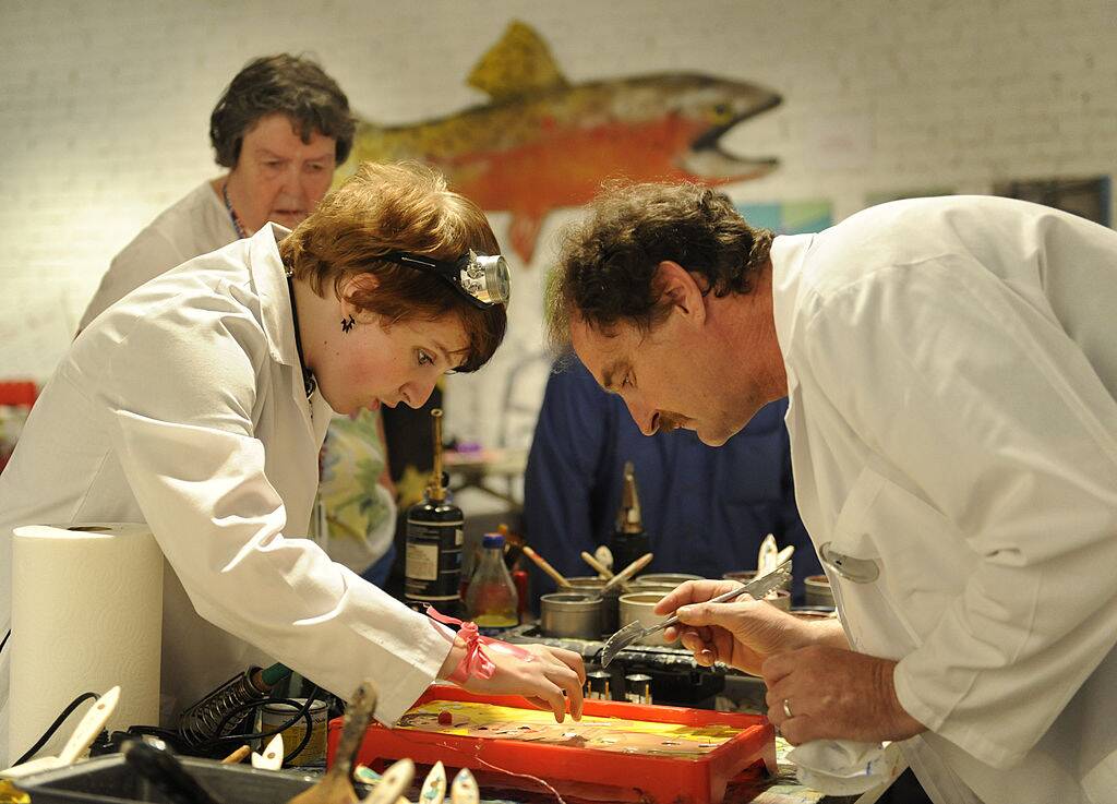 man and woman playing a board game