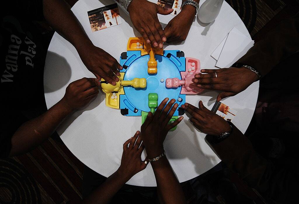 people playing hungry hungry hippos