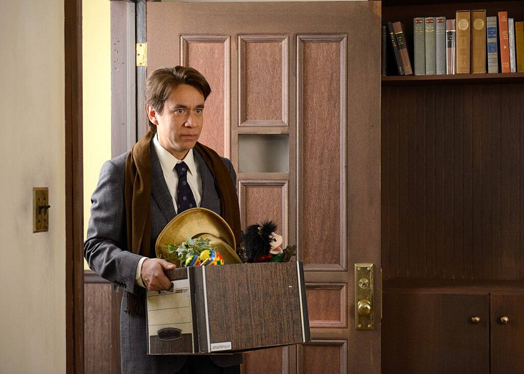 man walking into a room
