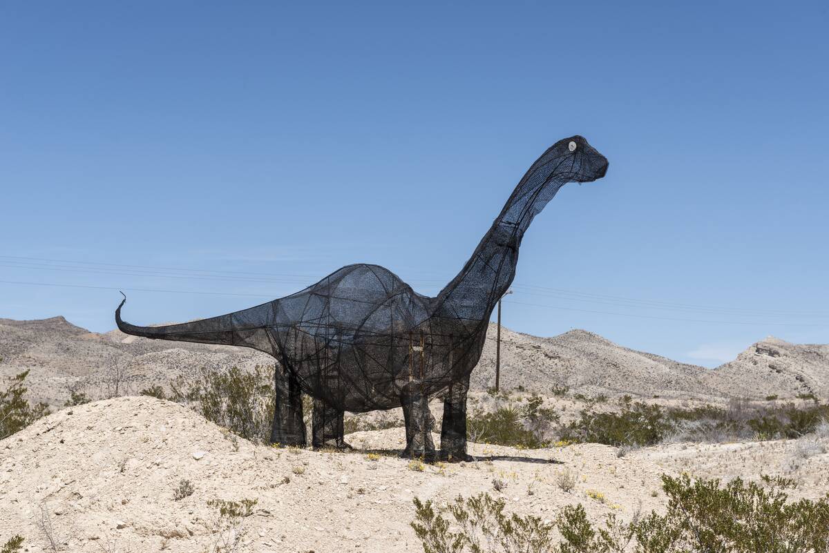 A whimsical dinosaur figure on Lone Star Ranch Road, which connects Big Bend National Park with its