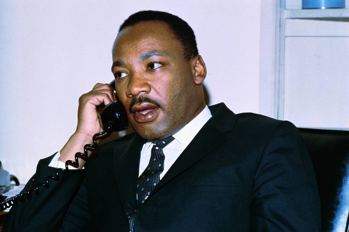 Martin L. King Jr. Conversing by Telephone
