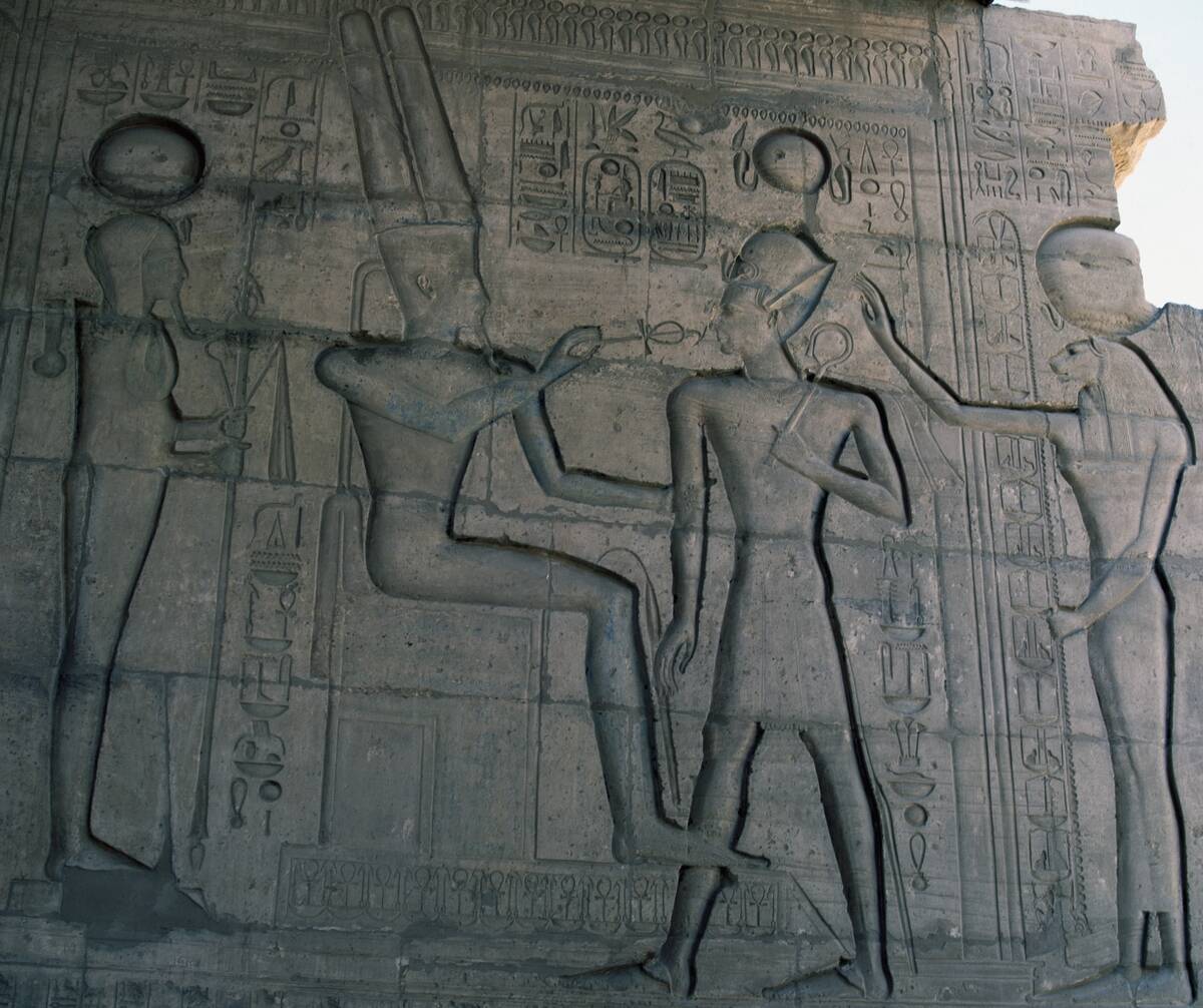 Amon opening Ramesses II's mouth...