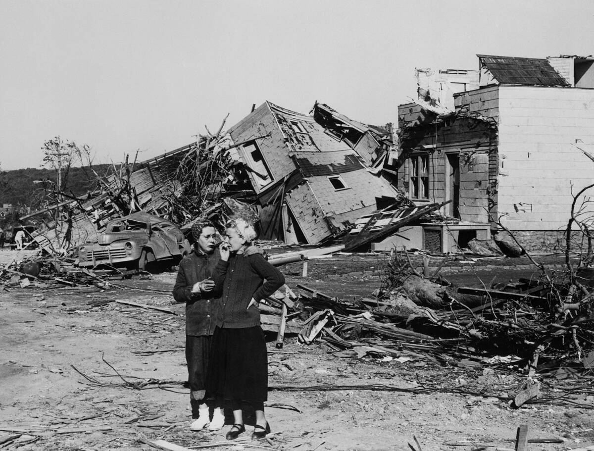 Two Women in Front of a Destroyed Home