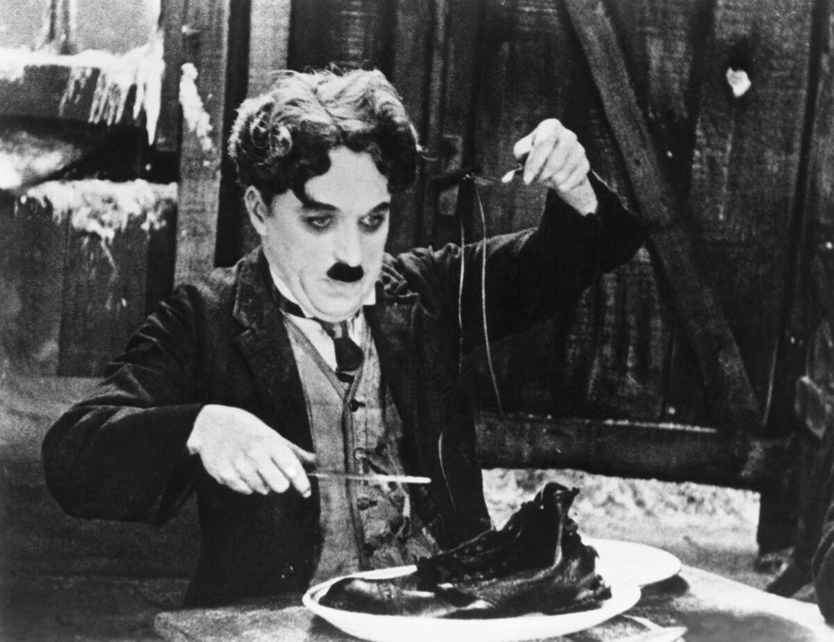 Charlie Chaplin in the Shoe-Eating Scene from The Gold Rush.