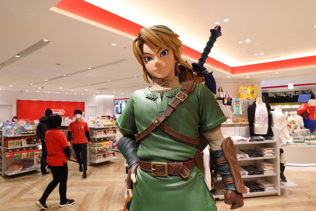 Link figurine from Legend of Zelda with shop staff inside...