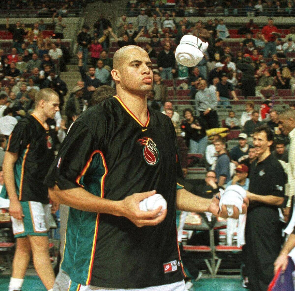 Detroit Pistons player Bison Dele juggles t-shirts