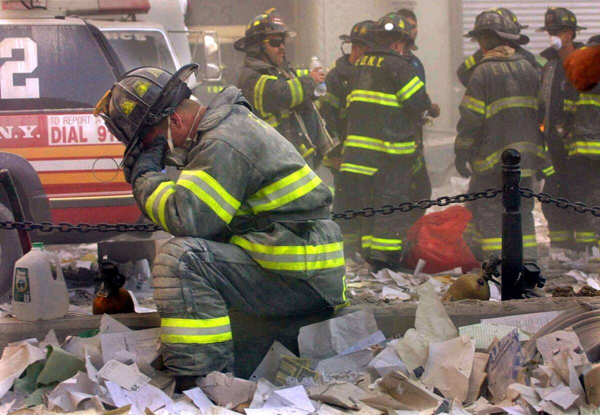 Firefighter Prays On September 11