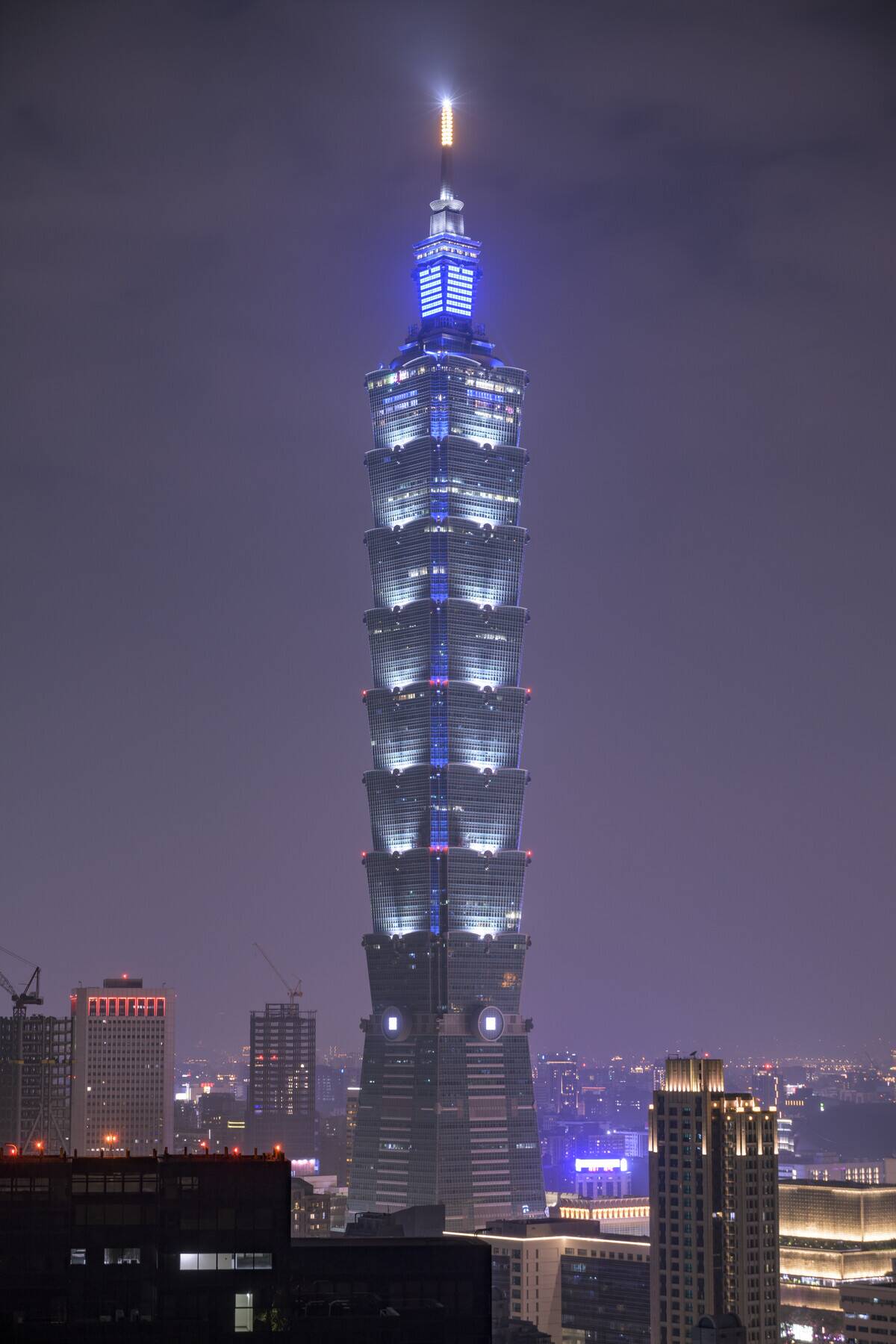 Iconic Taipei 101 skyscraper lit up against the dark night...