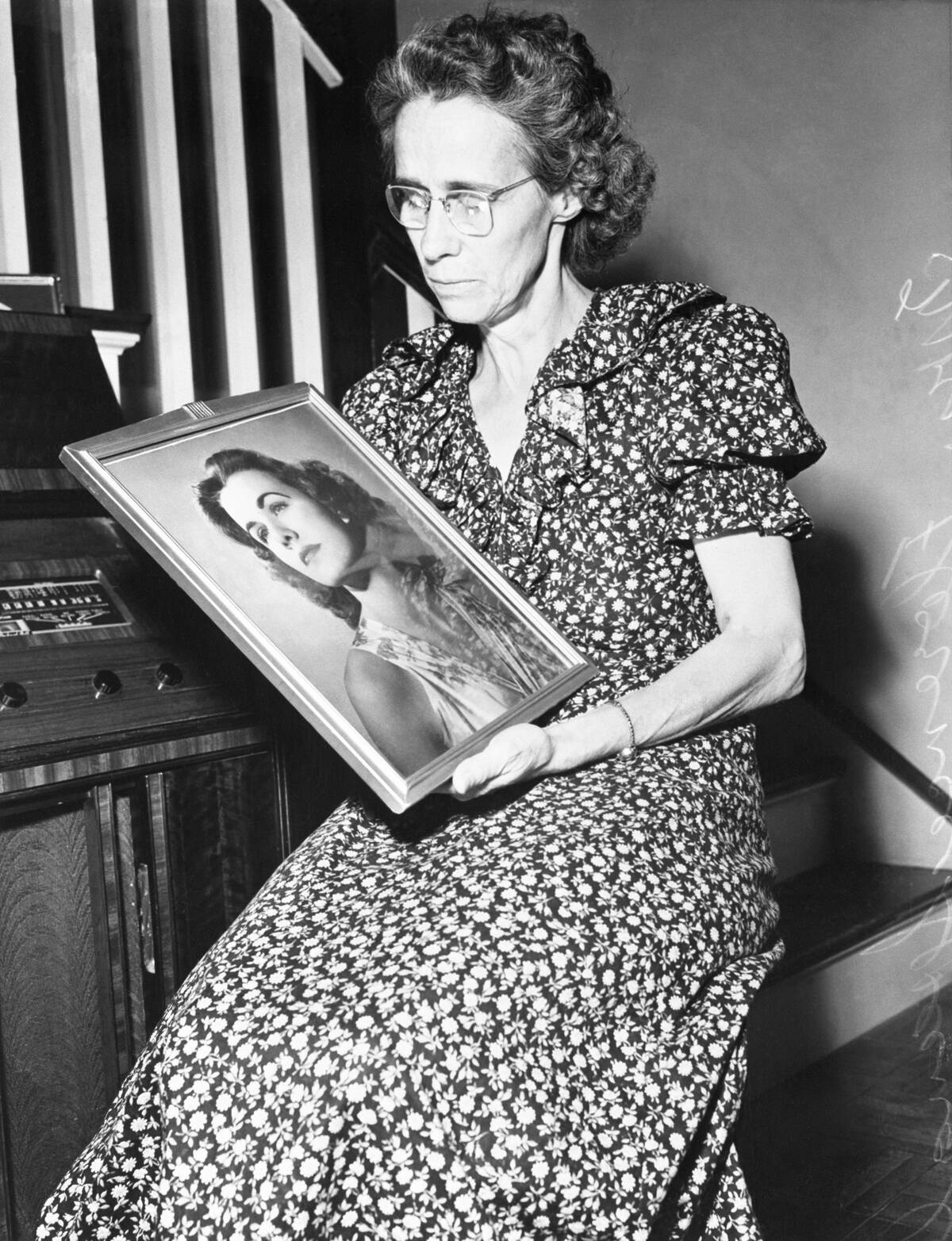 Mrs. Spangler Holds Portrait of Missing Daughter