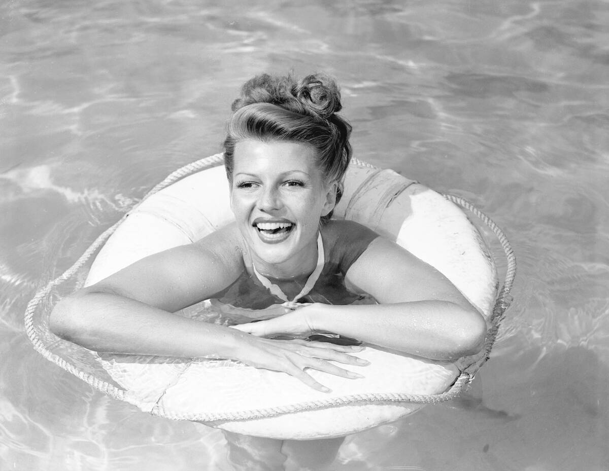 Rita Hayworth Posing in Swimming Pool