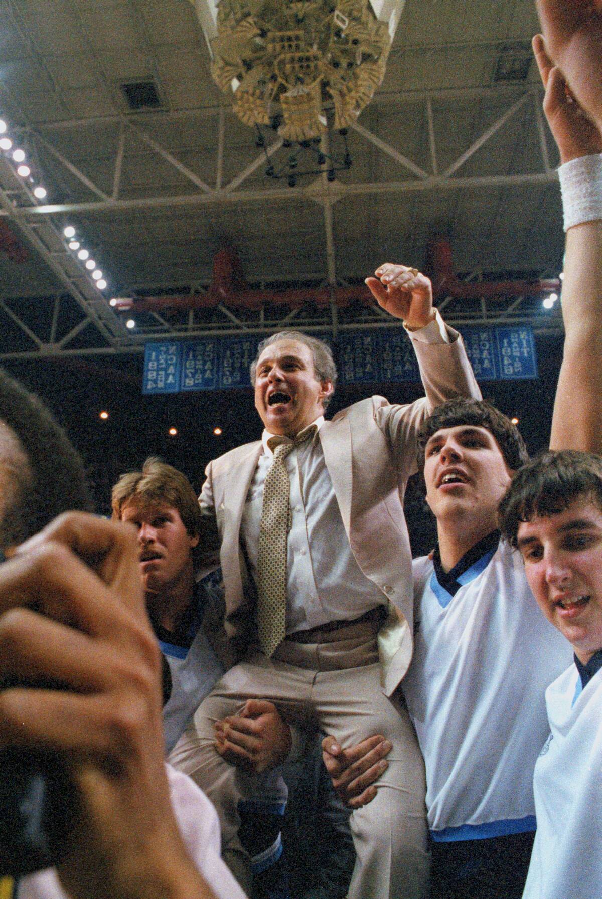 Coach Rollie Massimino Being Carried by His Team