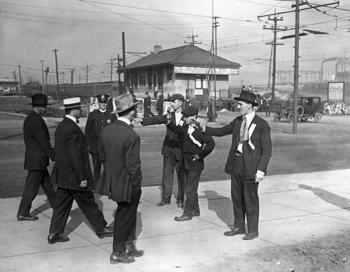 Group of Picketers Confronting Men