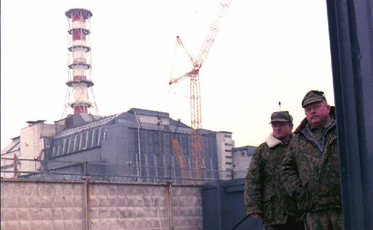 Security personnel guard the entrance of