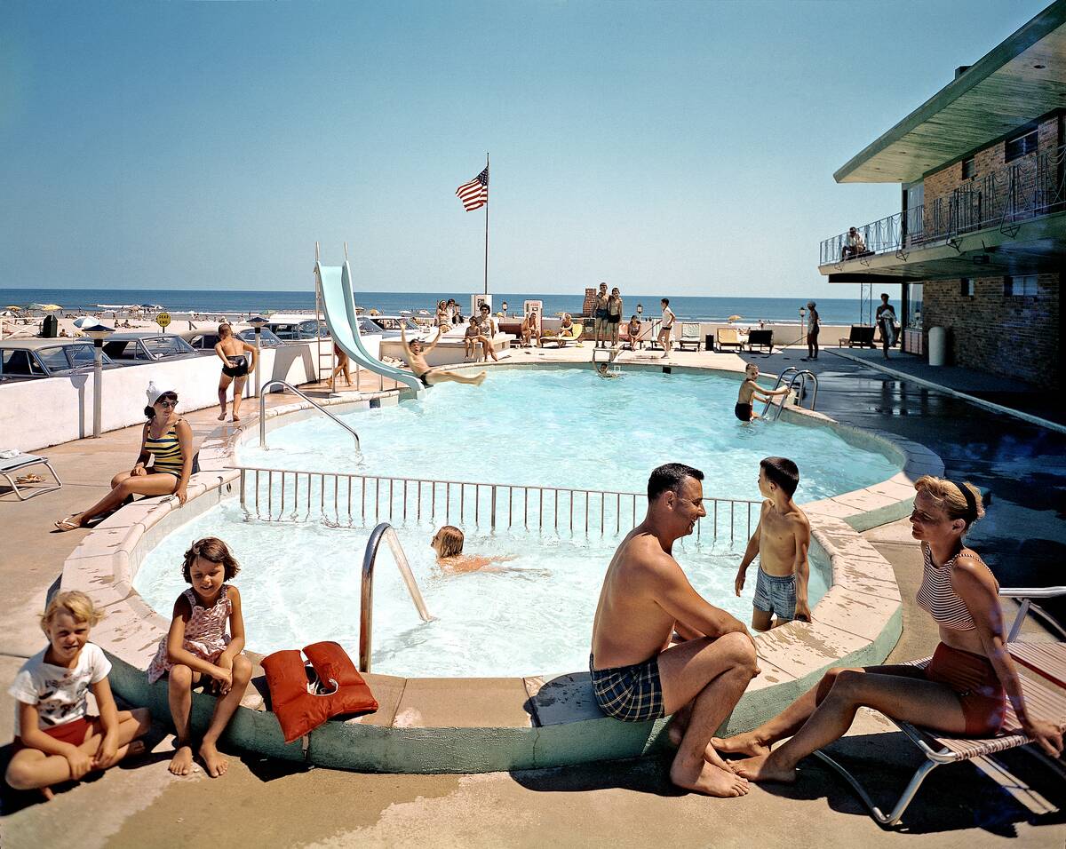 Tourists in Swimming Pool at Monterey Motel